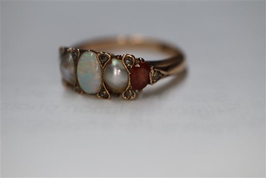 A Victorian 15ct, graduated white opal, split pearl and topaz? set half hoop ring, size O.